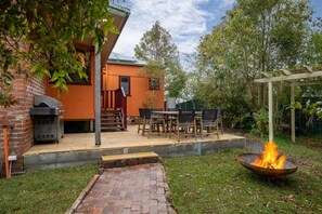 Soak up the crisp country air from the backyard, replete with alfresco dining, a BBQ and a fire pit.