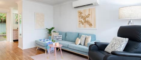 After a day of sightseeing, settle in on the sofa with a movie or a good book, with split system air-conditioning in the living area ensuring year-round comfort.
