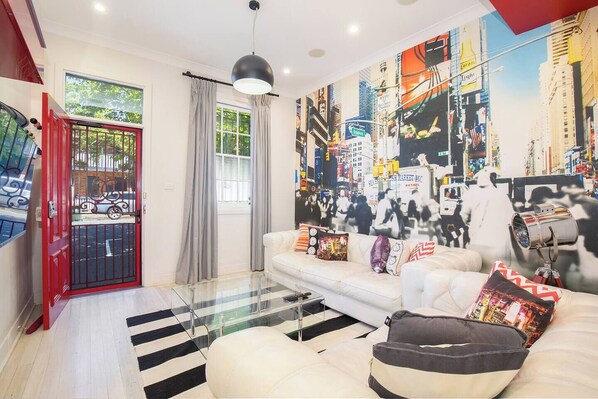 Step through the ruby red front door to find the eclectic living area, providing a bright and comfortable spot to kick back with some Netflix.