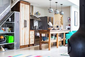 The centrepiece rustic-style kitchen is fitted with high quality stainless steel appliances ready for you to enjoy.