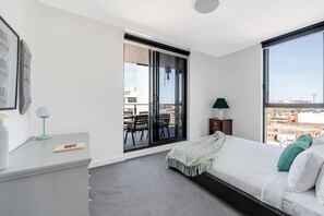 The master bedroom benefits from direct balcony access and its own private ensuite bathroom.
