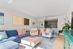 Experience the open plan living area seamlessly merging with the dining space and kitchen. The soothing pastel touches throughout add a touch of serenity to this interconnected haven.