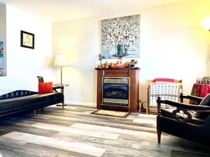Shared living space with gas fireplace in downstairs lobby