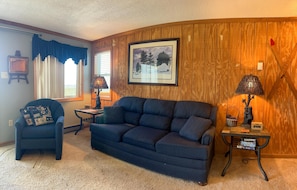 The cozy living room with sofa pullout bed sleeps up to two additional people.