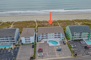 First-floor corner-unit -- just 6 stairs between you and the beach!