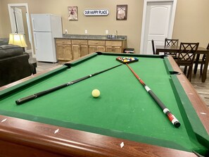 Play a game of pool while you watch the game!