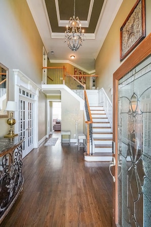 Amazing entrance with stairs to the 1st floor and chandelier