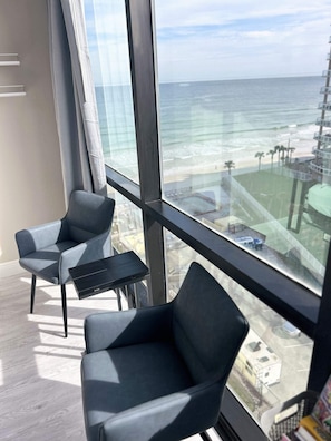 Seating area by the window with Ocean & City view