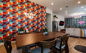 Gather for a family meal or game night under this bold dining space. Retro vibes