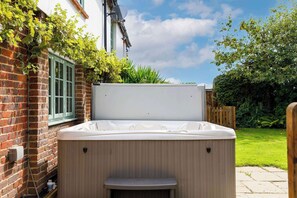 Relax in the hot tub as the sun sets and the stars come out.
