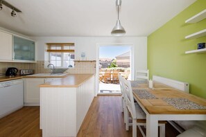 The spacious kitchen diner opens out to the beautiful garden