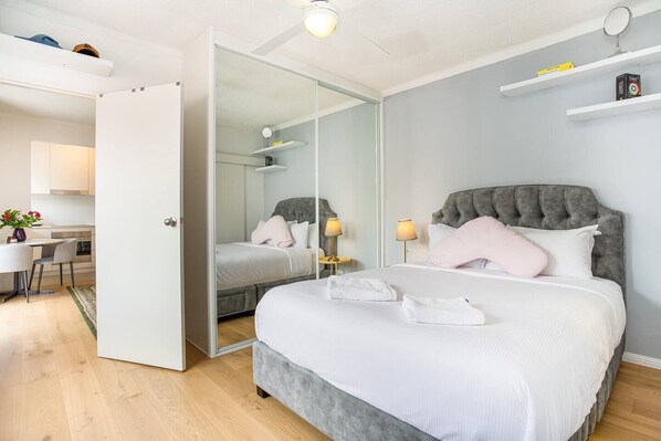 Get comfortable in a plush queen-sized bed, while making use of plenty of wardrobe space for your belongings.