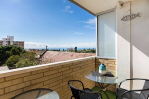 The private balcony offers a two-seater setting to enjoy your morning coffee alfresco.