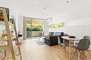 A small dining table makes it easy to enjoy meals at home or use as a dedicated workspace if you’re here on business.
