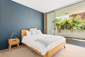 The bedroom is set with a sumptuous queen-sized bed and opens straight to the courtyard.

