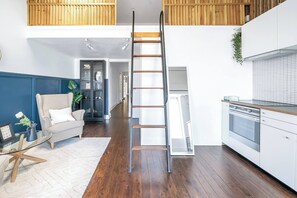 Up the ladder, you'll find the mezzanine level offering a cosy double bed.