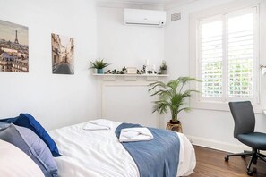 The queen-sized second bedroom comes with a dedicated workspace for those needing to set up their laptop.
