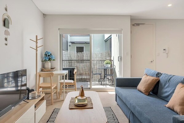 The living area extends to a private patio where you can enjoy your morning coffee or an afternoon wine.