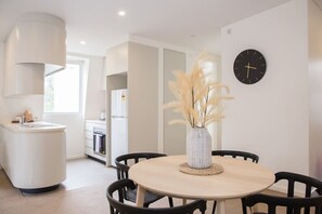 A dining table set for four offers plenty of space to enjoy a meal at home, or set up your laptop and catch up on work.