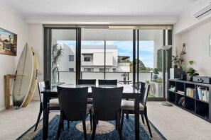 The dining area flows to the balcony, creating a lovely transition between indoors and out.