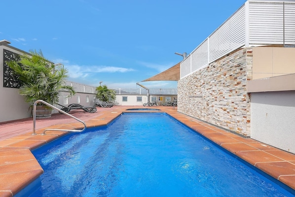 The shared pool and rooftop area is the perfect place to relax under the sun.
