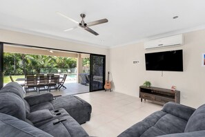 Sliding glass doors open from the loungeroom out to the patio.