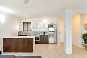 The kitchen comes well equipped for meals at home with an oven, stove, microwave and dishwasher.