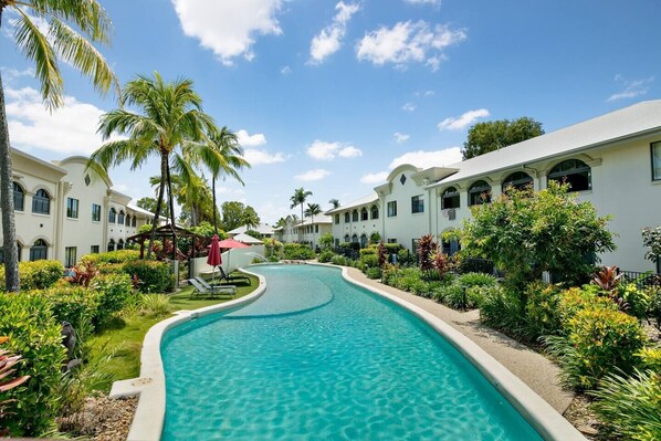 Cool off with a dip in the resort swimming pool, or simply relax on the day beds.