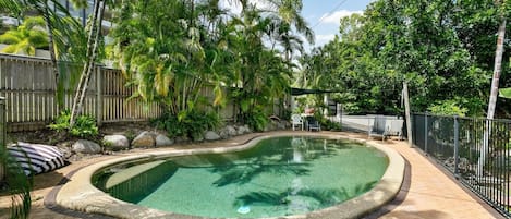 Cool off in the residents’ lagoon-style swimming pool, with day beds to relax in the sun.
