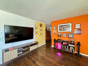 Retro living room with smart TV, stereo with bluetooth connectivity and plenty of vinyl records