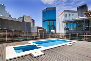 Lay out a towel and spend sunny days soaking in city views in between dips in the shared rooftop pool.