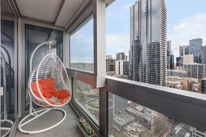 Get comfortable on this roomy egg chair to gaze out at the darkening skies.