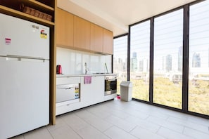 Whip you a meal in the compact kitchen while soaking up CBD views.