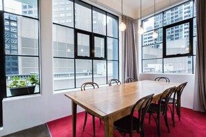 Dine together at the seven-seater timber table.