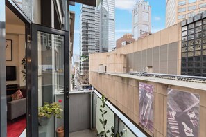A compact balcony looks over the bustling Flinders Lane.