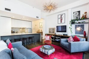 The apartment boasts open-plan living and dining.