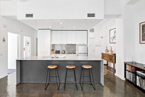 The oversized kitchen island offers seating for you to enjoy a quick bite to eat or set up your laptop and work from home.