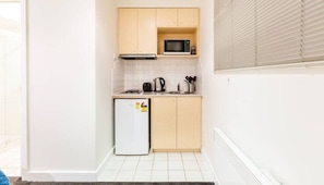 A kitchenette is equipped with basic cooking appliances for your stay.