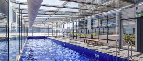 Swim some laps in the fully-enclosed shared pool within the complex.