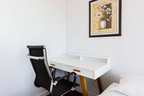 In the second bedroom, you'll find a dedicated study nook, perfect for those needing a quiet place to take Zoom calls.