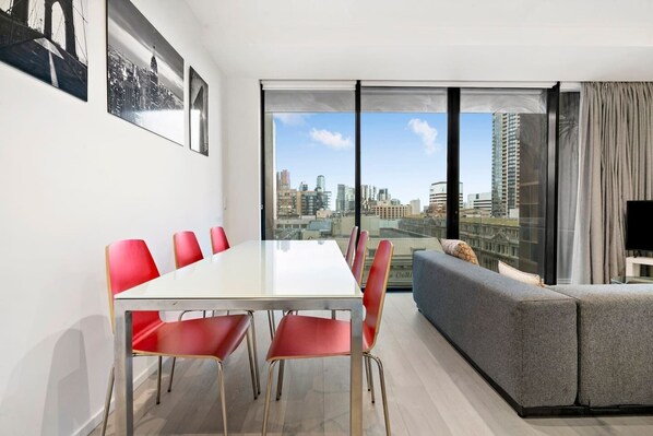 Dine at the spacious six-seater table, taking in views across the Melbourne skyline.