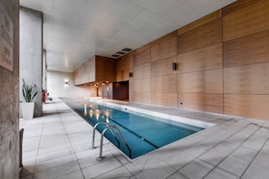 This apartment comes with resort-style amenities, including an indoor lap pool perfect for unwinding after a busy day.
