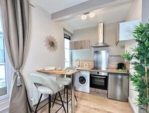 Dining table with view on kitchen and living room