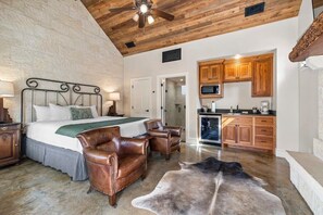 Room with living area and kitchen area