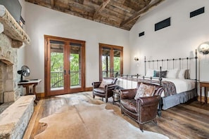 Room with king bed and living area