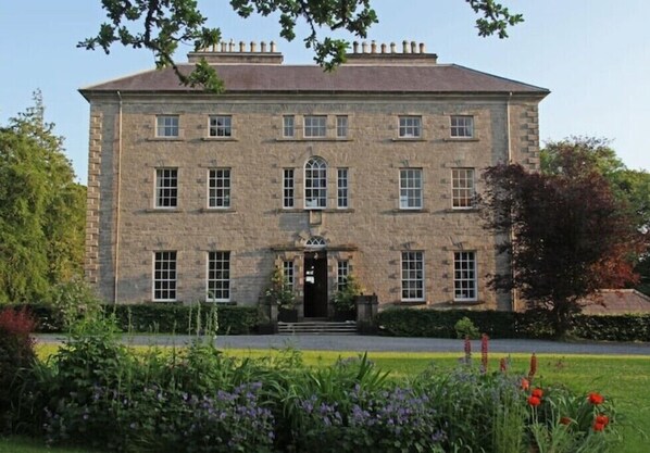 Frontal view of the house set in 500 acres of farm and forest.
