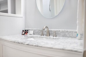 Freshen up in the bathroom, featuring a clean, spacious vanity and plenty of room to relax.