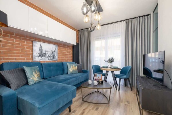 Living room with a comfortable sofa and TV. 