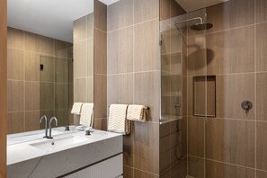 Start your day right with a refreshing shower in this modern walk-in shower design