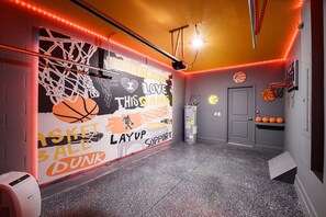 Air conditioned hot shot hoop court in the garage!